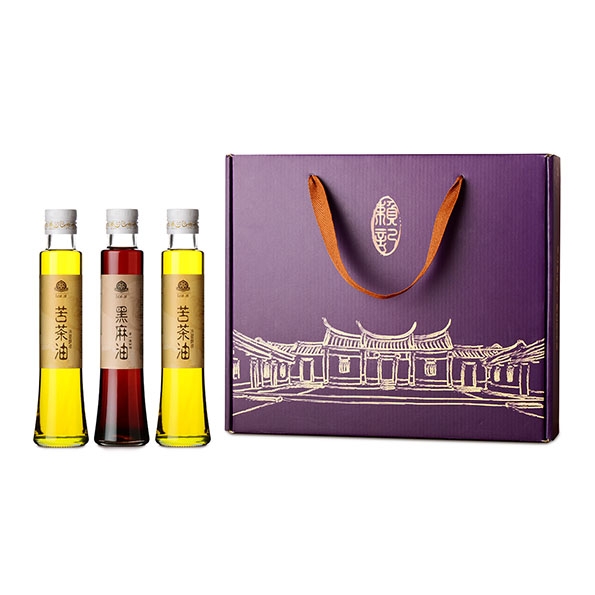 賴記苦茶油昕晨苦茶油禮盒，內含兩瓶苦茶油、一瓶黑麻油，紫色禮盒包裝。